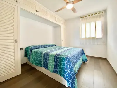 Cama o camas de una habitación en Lloguer 30 Grumet piscina y parquing