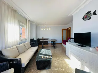 Una televisión o centro de entretenimiento en Brunasmar – Piscina, Parking y Centro Tossa