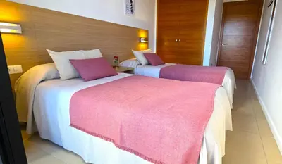 Cama o camas de una habitación en NEXTHOME City Center & Pool