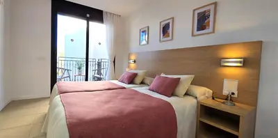 Cama o camas de una habitación en NEXTHOME City Center & Pool