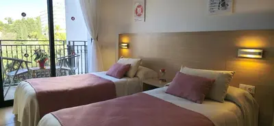Cama o camas de una habitación en NEXTHOME City Center & Pool