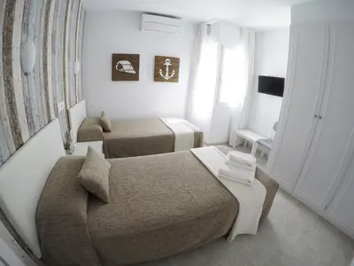Cama o camas de una habitación en Hostal del Mar