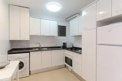 Una cocina o zona de cocina en Apto Lyra cerca de playa 5 huéspedes