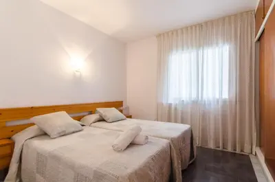 Cama o camas de una habitación en Apto Lyra cerca de playa 5 huéspedes
