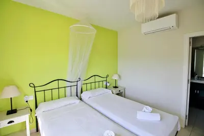 Cama o camas de una habitación en Villa Rosa