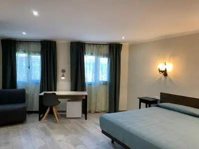 Cama o camas de una habitación en Hostal Milana Girona