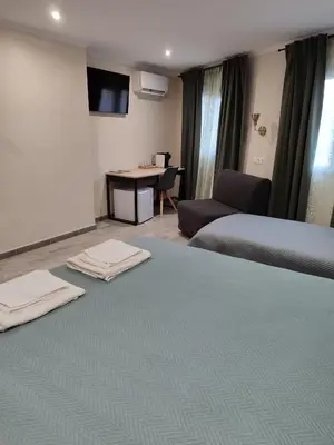 Cama o camas de una habitación en Hostal Milana Girona