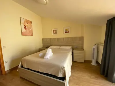 Cama o camas de una habitación en Reconnectar Blanes Montserrat