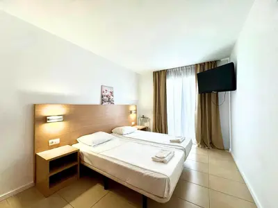Cama o camas de una habitación en Trimar Holidays Apartment