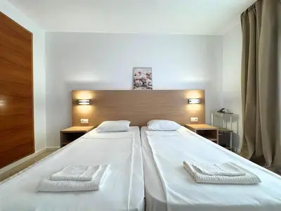 Cama o camas de una habitación en Trimar Holidays Apartment