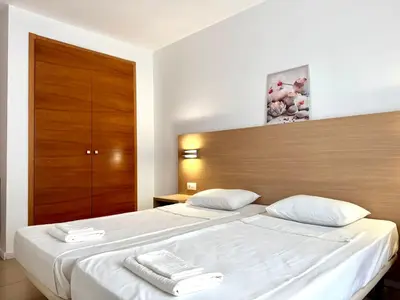 Cama o camas de una habitación en Trimar Holidays Apartment