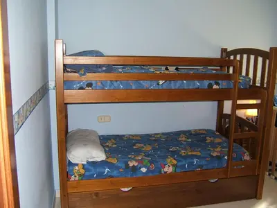 Cama o camas de una habitación en APARTAMENTO ÁTICO CON TERRAZA a 2 MINUTOS DE LA PLAYA