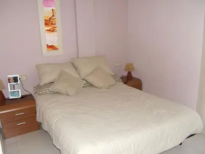 Cama o camas de una habitación en APARTAMENTO ÁTICO CON TERRAZA a 2 MINUTOS DE LA PLAYA