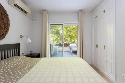 Cama o camas de una habitación en SeaBreezeHeaven - Sea View Apartment, Pool & Spacious Terrace with BBQ - 50m from Sant Pol Beach