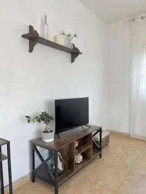 Una televisión o centro de entretenimiento en Nature House