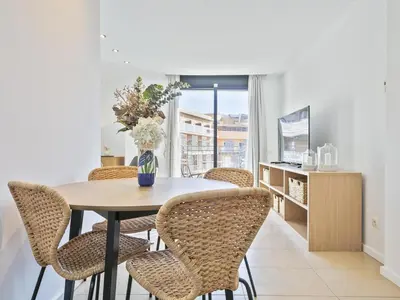 Una televisión o centro de entretenimiento en Winahost Lloret Brisa