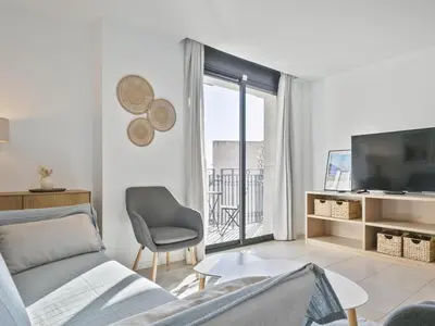Una televisión o centro de entretenimiento en Winahost Lloret Brisa