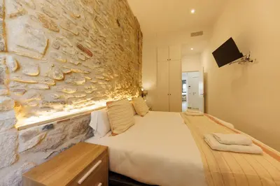 Cama o camas de una habitación en Bravissimo Pont Sant Agusti, Monthly Apartments