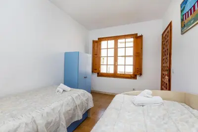 Cama o camas de una habitación en La Paloma
