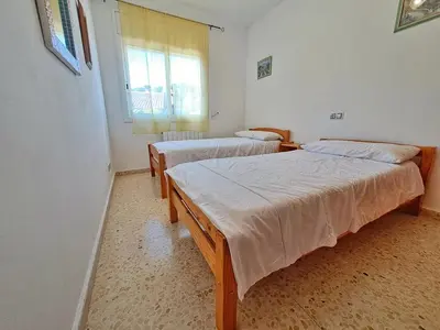 Cama o camas de una habitación en Villa Xaloc 12 pax piscina privada - 15km Lloret de Mar