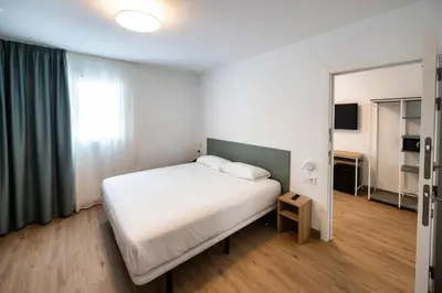 Cama o camas de una habitación en Hotel Calella by Beatriz Hoteles