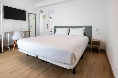 Cama o camas de una habitación en Hotel Calella by Beatriz Hoteles
