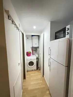 Una cocina o zona de cocina en Apartaments Muntaner I