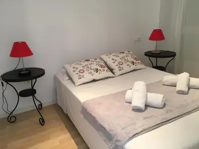 Cama o camas de una habitación en Apartaments Muntaner I