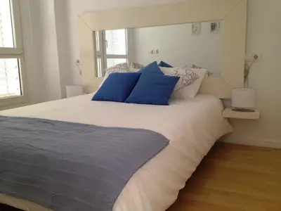 Cama o camas de una habitación en Apartaments Muntaner I