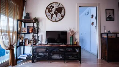 Una televisión o centro de entretenimiento en Apartaments Muntaner I