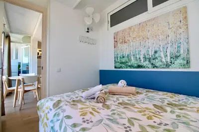 Cama o camas de una habitación en Hauzify I Apartament Nàutic