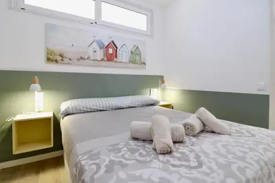 Cama o camas de una habitación en Hauzify I Apartament Nàutic