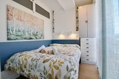 Cama o camas de una habitación en Hauzify I Apartament Nàutic