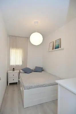 Cama o camas de una habitación en Apartamento con piscina en Sant Pol de Mar