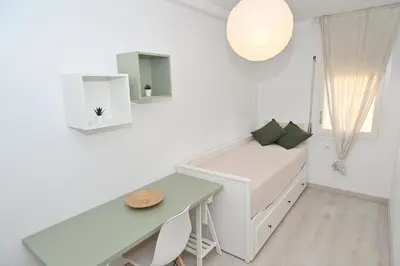 Cama o camas de una habitación en Apartamento con piscina en Sant Pol de Mar