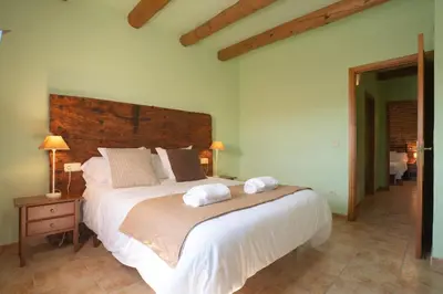 Cama o camas de una habitación en Can Pujol - Casa Rural 16-20 personas