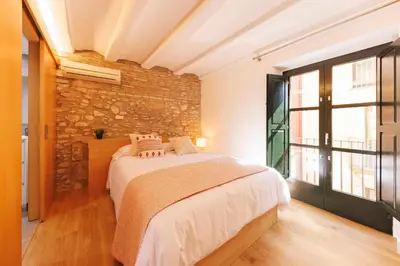 Cama o camas de una habitación en Bravissimo Calderers, Monthly Apartments