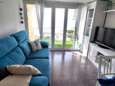 Una televisión o centro de entretenimiento en Apartamentos con vistas al mar