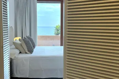 Cama o camas de una habitación en LETS HOLIDAYS Dúplex Frente Al Mar, Piscina Panorámica, Dos Pkg
