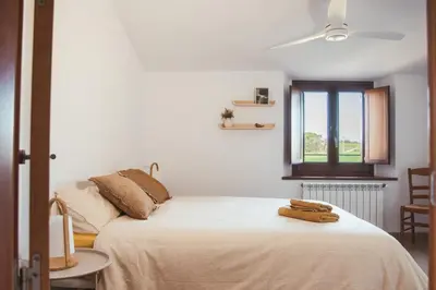 Cama o camas de una habitación en Cal Teixidor de Cartellà, Sant Gregori GIRONA
