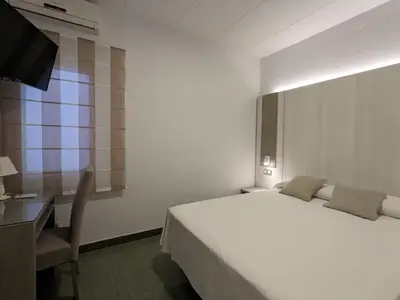 Cama o camas de una habitación en Hotel Capri