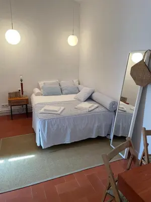 Cama o camas de una habitación en Casa con jardín y barbacoa