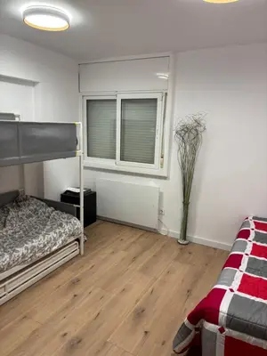 Cama o camas de una habitación en A dos minuts del mar