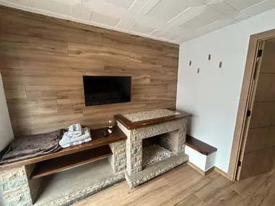 Una televisión o centro de entretenimiento en Habitació amb encant a Blanes