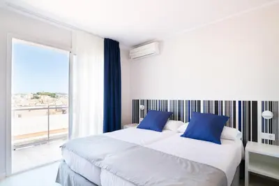 Cama o camas de una habitación en Ibersol Sorra d'Or
