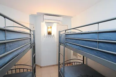 Cama o camas de una habitación en Apartamento BLUE PARADISE