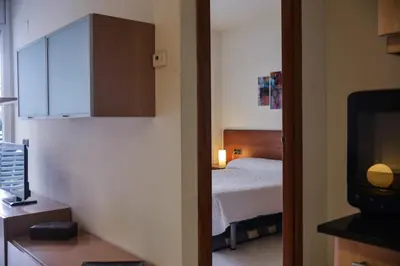 Cama o camas de una habitación en Beachfront Apartment with Pool and Garden S Abanell Blanes
