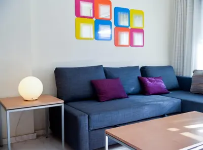Zona de estar de Beachfront Apartment with Pool and Garden S Abanell Blanes