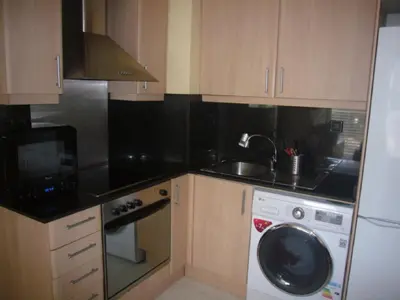 Una cocina o zona de cocina en Beachfront Apartment with Pool and Garden S Abanell Blanes