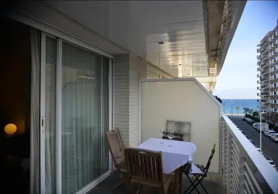 Un balcón o terraza de Beachfront Apartment with Pool and Garden S Abanell Blanes